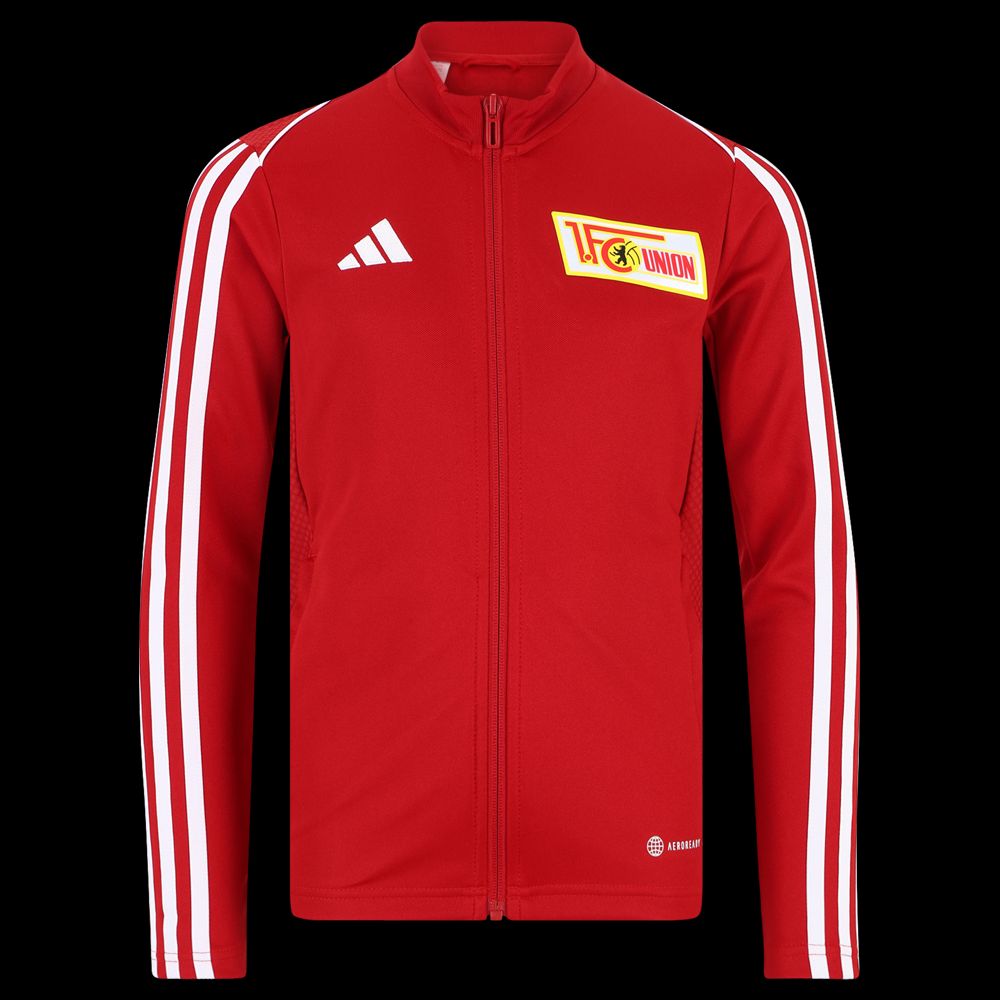 Rote Trainingsjacke. Sie hat weiße Streifen. Auf der linken Brust ist ein Logo vom FC Union Berlin.