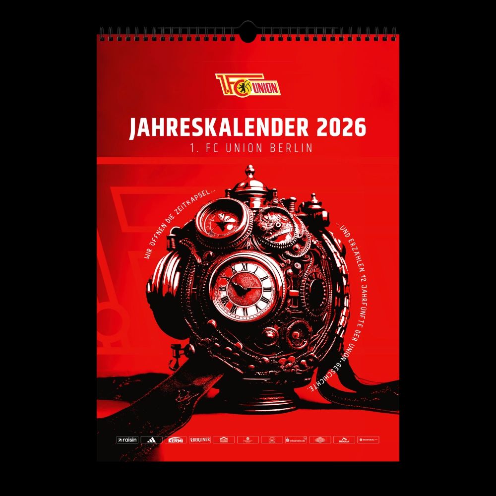 Ein Wandkalender für das Jahr 2026 des 1. FC Union Berlin mit einem auffälligen, rot-goldfarbenen Design und einem historischen Uhrenmotiv.