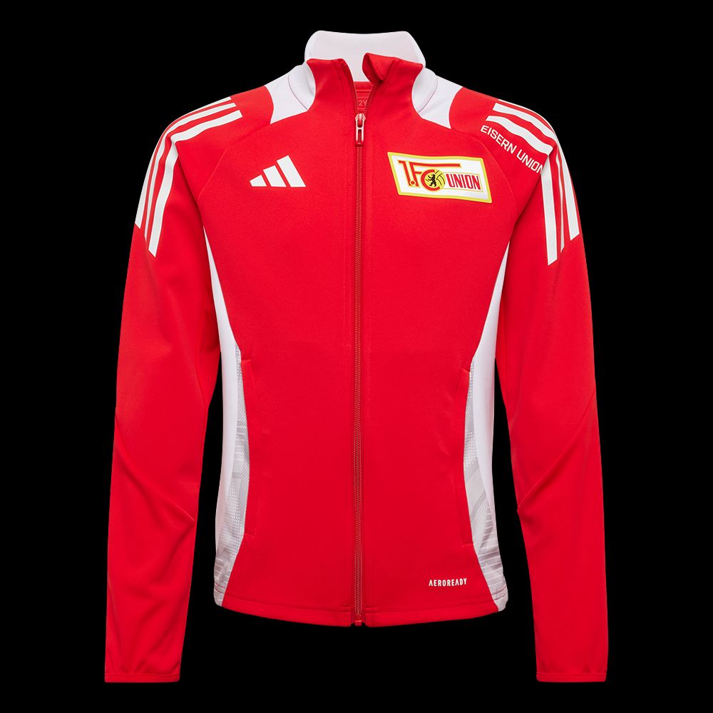Roter Trainingsanzug. Er hat weiße und goldene Details. Auf der Vorderseite ist das Logo von einem Sportverein.
